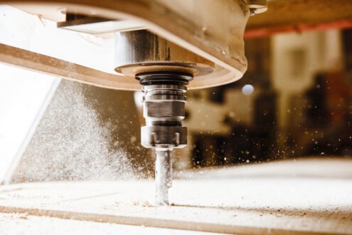 CNC milling machine. Machine tool in wood factory with drilling machines.